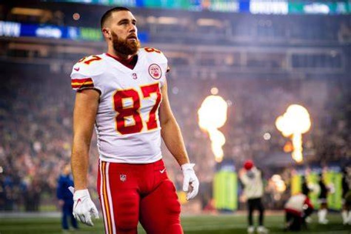 Travis Kelce #87 of the Kansas City Chiefs celebrates with Taylor Swift after a 17-10 victory against the Baltimore Ravens in the AFC Championship ...